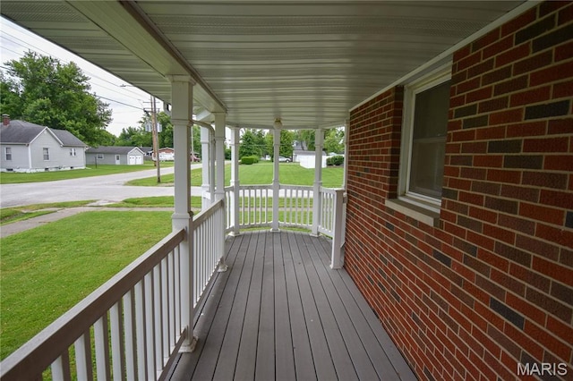411 S Walnut St, Mount Olive, IL 62069 - porch featuring a yard and a residential view