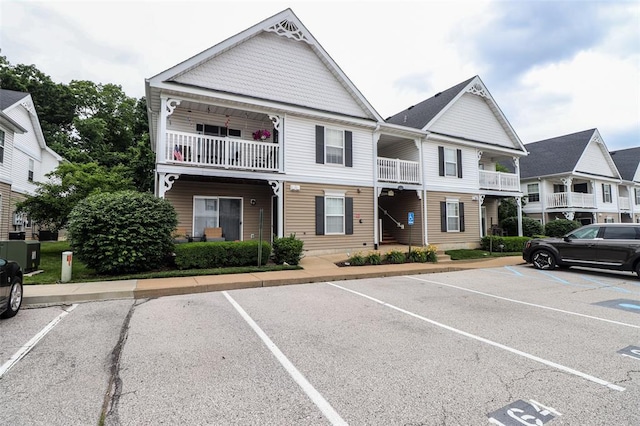 164 Brandy Mill Cir Unit 6G, High Ridge, MO 63049 - view of property with uncovered parking, central AC, and a balcony