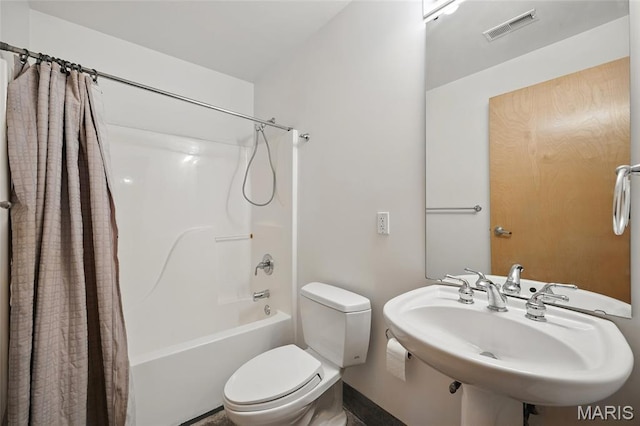 1312 Washington Ave Unit 2A, Saint Louis, MO 63103 - full bathroom featuring shower / bathtub combination with curtain and toilet