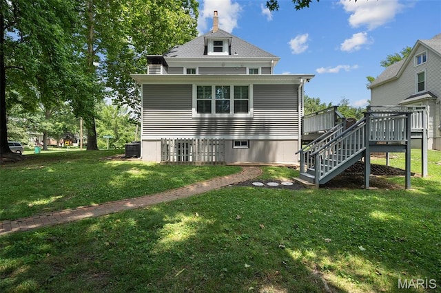 102 Portland Ter, Webster Groves, MO 63119 - back of property with stairs, a lawn, and a deck