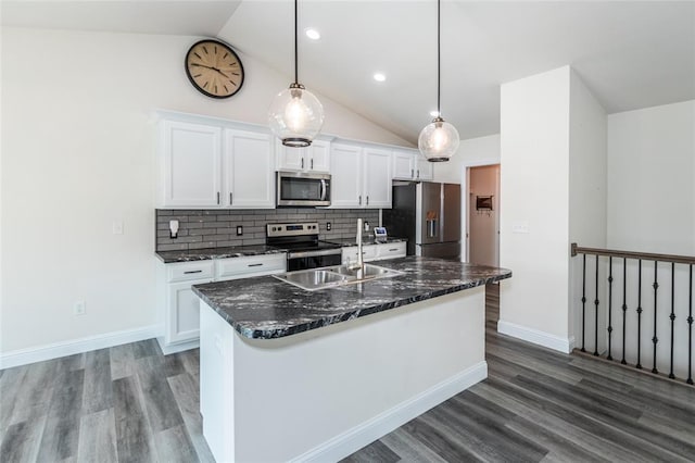 312 Andy Habsieger St, Festus, MO 63028 - kitchen with stainless steel appliances, lofted ceiling, a sink, white cabinets, and wood finished floors