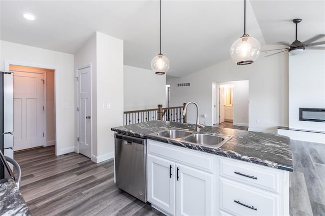 312 Andy Habsieger St, Festus, MO 63028 - kitchen with appliances with stainless steel finishes, a sink, vaulted ceiling, wood finished floors, and white cabinetry