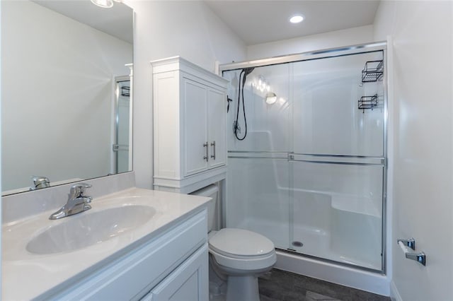 312 Andy Habsieger St, Festus, MO 63028 - full bathroom with a shower stall, vanity, toilet, wood finished floors, and recessed lighting