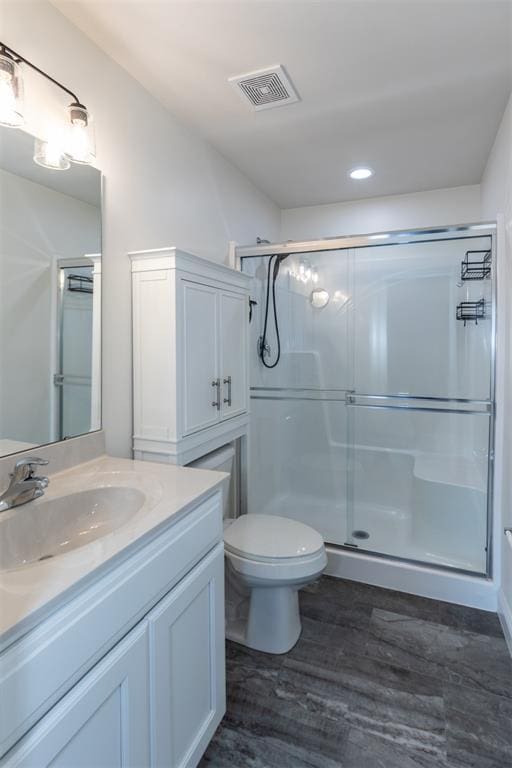 312 Andy Habsieger St, Festus, MO 63028 - full bathroom featuring vanity, a shower stall, toilet, wood finished floors, and recessed lighting