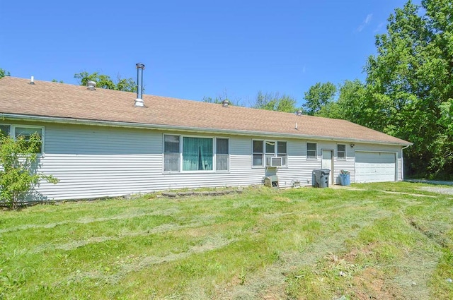 4090 E Pelot Ln, Alton, IL 62002 - back of property featuring an attached garage, a yard, and cooling unit
