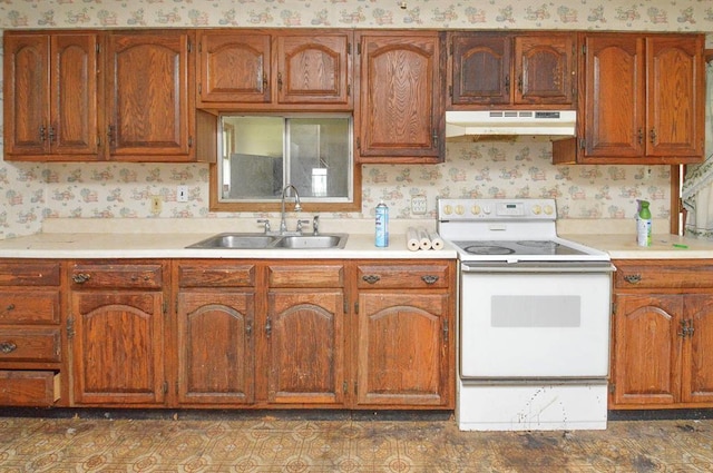4090 E Pelot Ln, Alton, IL 62002 - kitchen featuring a sink, under cabinet range hood, white electric stove, wallpapered walls, and light countertops