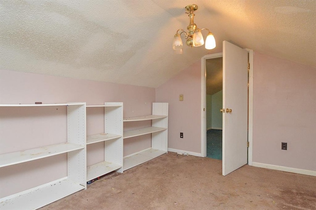 4090 E Pelot Ln, Alton, IL 62002 - additional living space with a textured ceiling, a chandelier, lofted ceiling, carpet, and baseboards