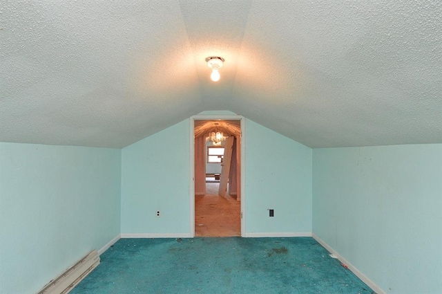 4090 E Pelot Ln, Alton, IL 62002 - additional living space with a textured ceiling, vaulted ceiling, carpet, and baseboards