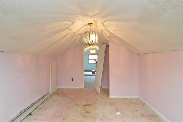 4090 E Pelot Ln, Alton, IL 62002 - bonus room with a textured ceiling, lofted ceiling, and a chandelier