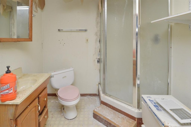 4090 E Pelot Ln, Alton, IL 62002 - bathroom featuring a shower stall, vanity, toilet, tile patterned floors, and baseboards