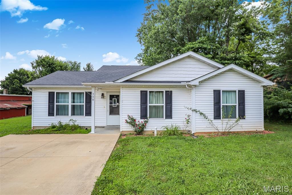 308 Madison St, Fredericktown, MO 63645 - ranch-style house with a front lawn and a shingled roof