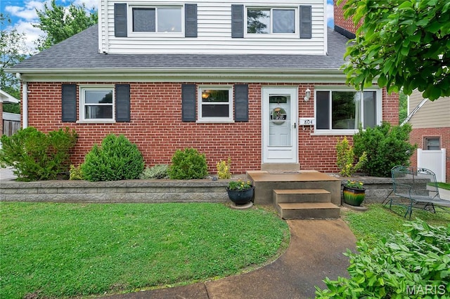 804 Tavalon Ave, Rock Hill, MO 63119 - view of front facade featuring a shingled roof, brick siding, and a front yard