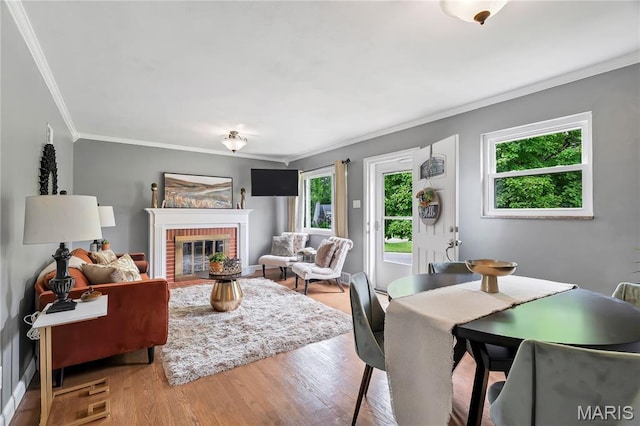 804 Tavalon Ave, Rock Hill, MO 63119 - living area featuring crown molding, wood finished floors, and a brick fireplace