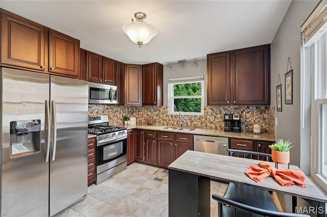 804 Tavalon Ave, Rock Hill, MO 63119 - kitchen with appliances with stainless steel finishes, backsplash, light stone counters, and light tile patterned floors