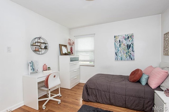 804 Tavalon Ave, Rock Hill, MO 63119 - bedroom with light wood-type flooring and baseboards