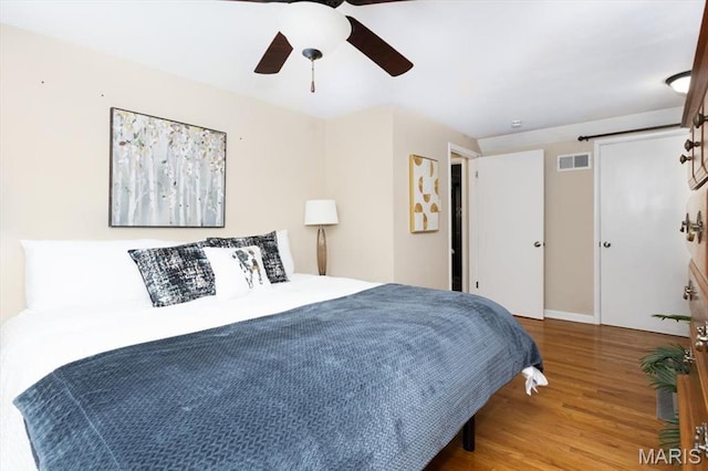 804 Tavalon Ave, Rock Hill, MO 63119 - bedroom featuring wood finished floors and a ceiling fan