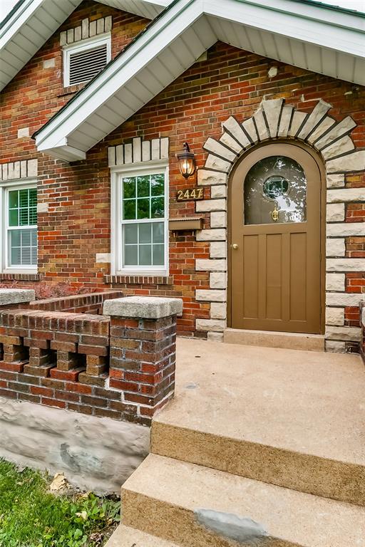 2447 Hartland Ave, Sycamore Hills, MO 63114 - property entrance with brick siding