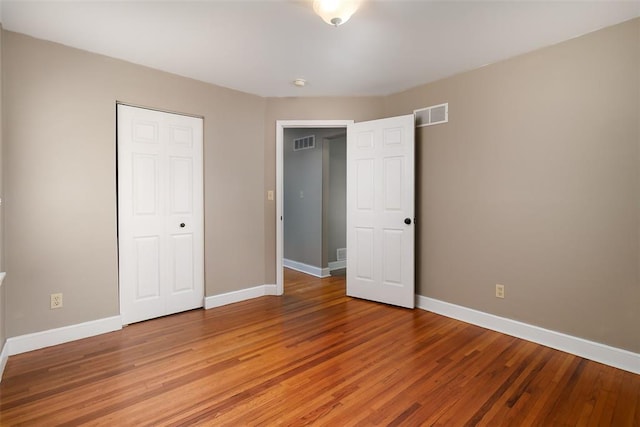2447 Hartland Ave, Sycamore Hills, MO 63114 - unfurnished bedroom featuring light wood-type flooring, baseboards, and a closet