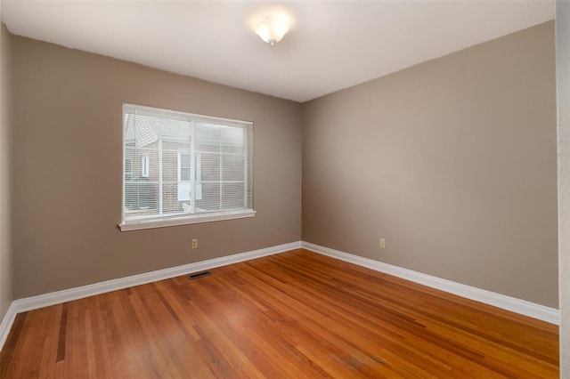 2447 Hartland Ave, Sycamore Hills, MO 63114 - spare room with baseboards and wood finished floors