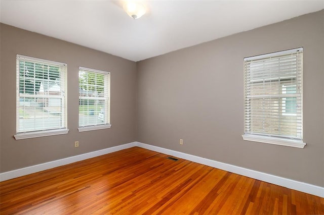 2447 Hartland Ave, Sycamore Hills, MO 63114 - unfurnished room featuring baseboards and light wood-type flooring