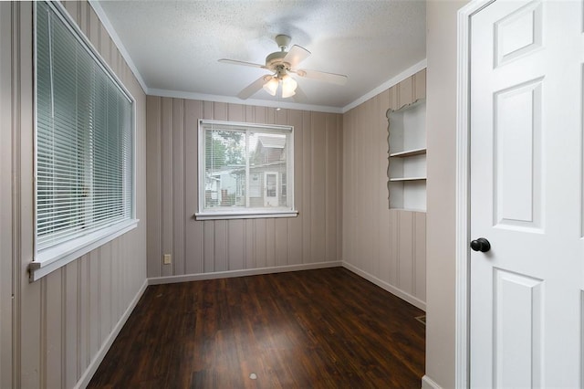 2447 Hartland Ave, Sycamore Hills, MO 63114 - unfurnished bedroom featuring crown molding, wood finished floors, baseboards, a textured ceiling, and ceiling fan