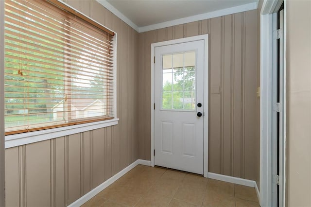 2447 Hartland Ave, Sycamore Hills, MO 63114 - doorway to outside featuring baseboards, crown molding, and light tile patterned floors