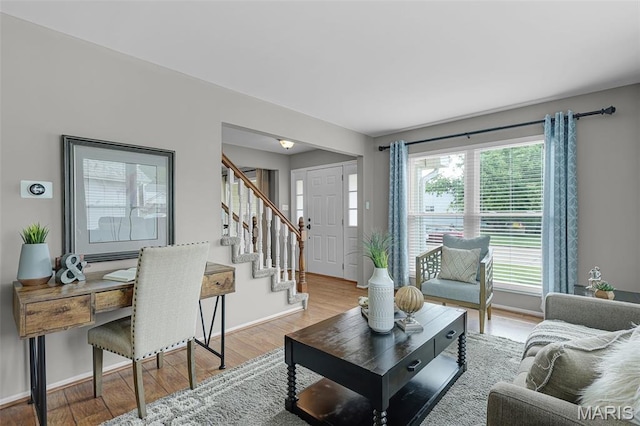 4667 Meramec Blvd, Eureka, MO 63025 - living room with stairs, light wood-style flooring, and baseboards