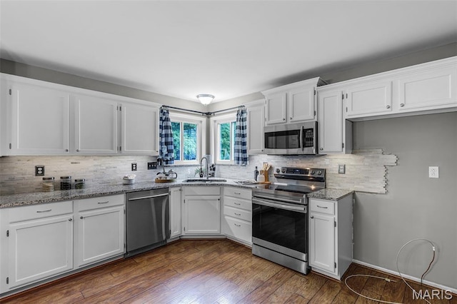 4667 Meramec Blvd, Eureka, MO 63025 - kitchen with appliances with stainless steel finishes, a sink, white cabinets, and backsplash
