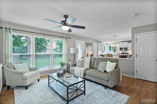 4667 Meramec Blvd, Eureka, MO 63025 - living room featuring a ceiling fan, hardwood / wood-style flooring, and a chandelier