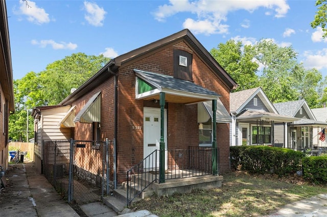 5337 Arsenal St, Saint Louis, MO 63139 - view of front of property featuring brick siding and a shingled roof