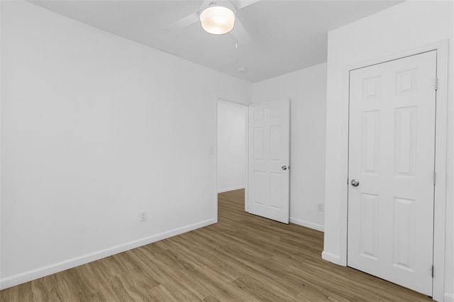 5337 Arsenal St, Saint Louis, MO 63139 - unfurnished bedroom with wood finished floors, baseboards, and a ceiling fan