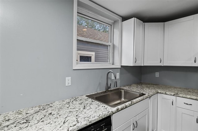 5337 Arsenal St, Saint Louis, MO 63139 - kitchen with a sink, white cabinets, and light stone counters
