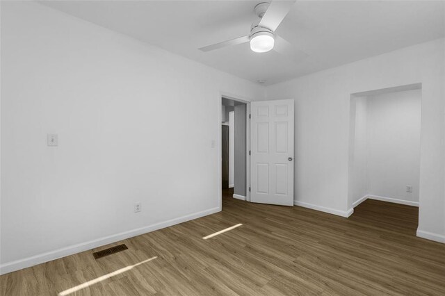 5337 Arsenal St, Saint Louis, MO 63139 - unfurnished room featuring a ceiling fan, baseboards, and wood finished floors