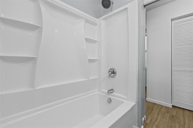 5337 Arsenal St, Saint Louis, MO 63139 - full bathroom with wood finished floors, bathing tub / shower combination, and baseboards