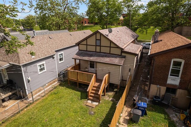 5337 Arsenal St, Saint Louis, MO 63139 - back of house with a wooden deck, a lawn, stairway, and roof with shingles