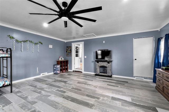 11454 State Highway 72, Millersville, MO 63766 - living area with crown molding, a ceiling fan, baseboards, and a fireplace