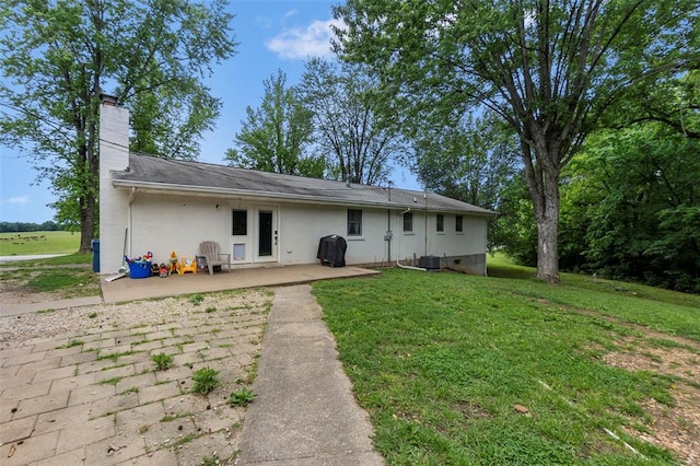 11454 State Highway 72, Millersville, MO 63766 - rear view of property featuring a patio area, a chimney, and a yard