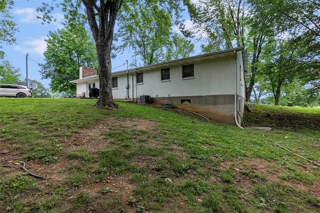 11454 State Highway 72, Millersville, MO 63766 - rear view of property featuring central AC unit, a yard, and a chimney