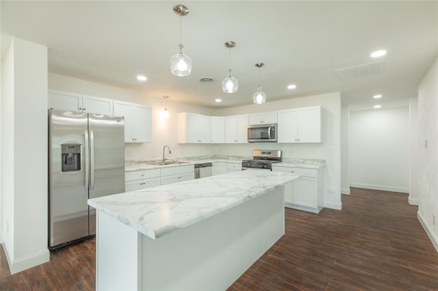 702 E Warren St, Bunker Hill, IL 62014 - kitchen with appliances with stainless steel finishes, a sink, baseboards, recessed lighting, and dark wood-type flooring