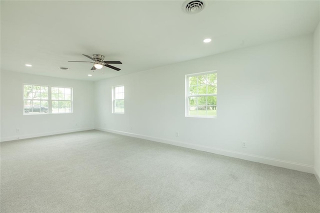 702 E Warren St, Bunker Hill, IL 62014 - spare room with recessed lighting, light carpet, baseboards, and a ceiling fan