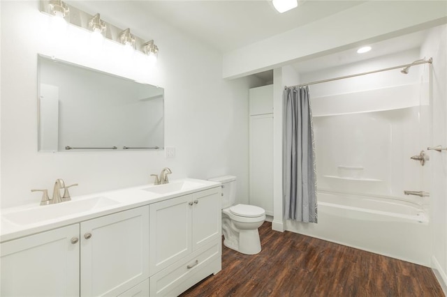 702 E Warren St, Bunker Hill, IL 62014 - bathroom with toilet, shower / bath combo, double vanity, and wood finished floors
