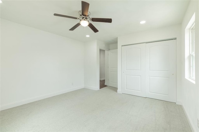 702 E Warren St, Bunker Hill, IL 62014 - unfurnished bedroom with light colored carpet, a closet, baseboards, recessed lighting, and ceiling fan