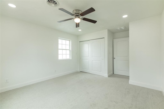 702 E Warren St, Bunker Hill, IL 62014 - unfurnished bedroom with light carpet, recessed lighting, a closet, baseboards, and a ceiling fan