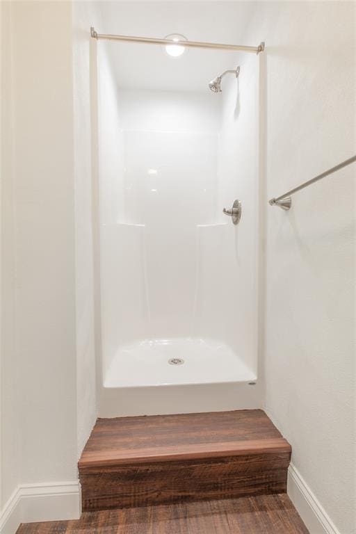 702 E Warren St, Bunker Hill, IL 62014 - full bathroom with baseboards and a shower