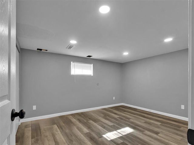 8668 Engler Ave, St John, MO 63114 - empty room with wood finished floors, recessed lighting, and baseboards