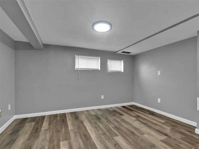8668 Engler Ave, St John, MO 63114 - below grade area featuring baseboards and wood finished floors