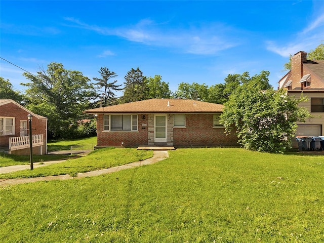 8668 Engler Ave, St John, MO 63114 - view of front of property with a front yard and brick siding
