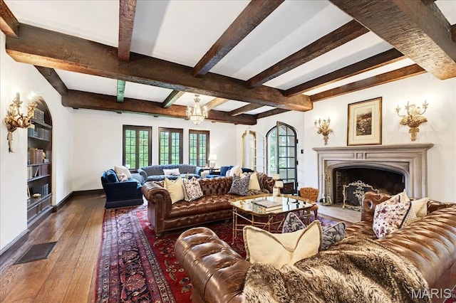 32 Woodoaks Trl, Ladue, MO 63124 - living area with wood-type flooring, beamed ceiling, and a premium fireplace