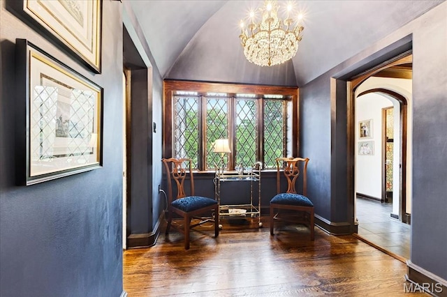 32 Woodoaks Trl, Ladue, MO 63124 - sitting room featuring arched walkways, hardwood / wood-style flooring, a chandelier, and vaulted ceiling