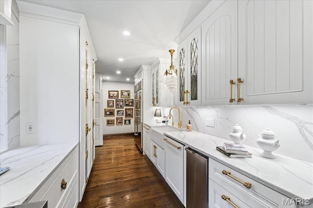 32 Woodoaks Trl, Ladue, MO 63124 - kitchen with stainless steel built in fridge, recessed lighting, dark wood-style flooring, tasteful backsplash, and white cabinetry